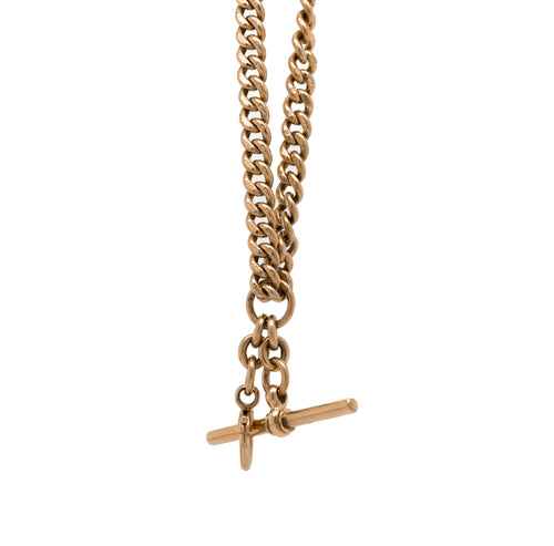 A rose gold antique Albert chain necklace with two lobster clasps and a T-bar and bolt ring.