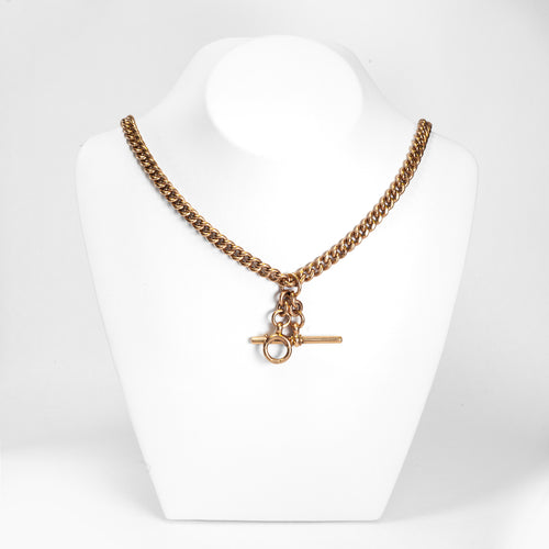 A rose gold antique Albert chain necklace with two lobster clasps and a T-bar and bolt ring.