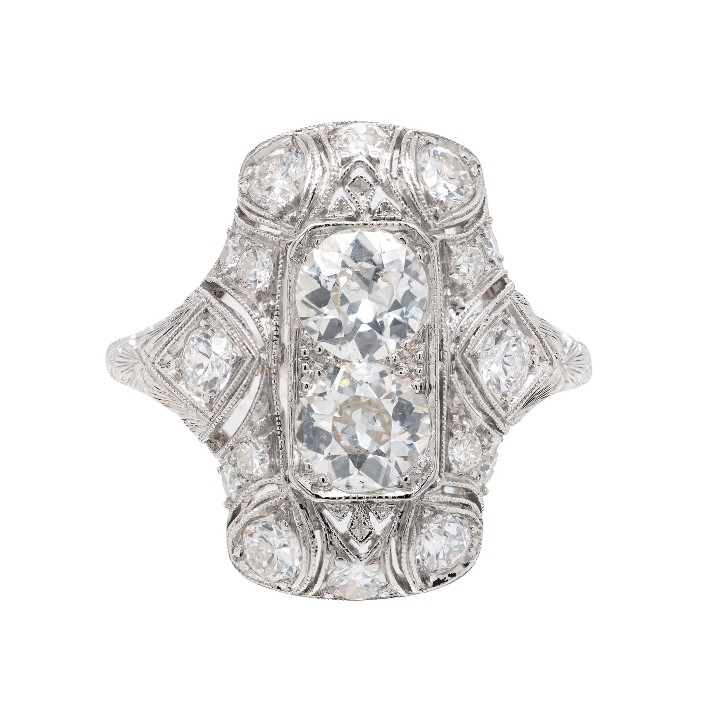 An antique Art Deco old mine cut diamond vertical platinum dress ring with smaller old European cut diamonds set in a rectangular panel with milgrain detailing.