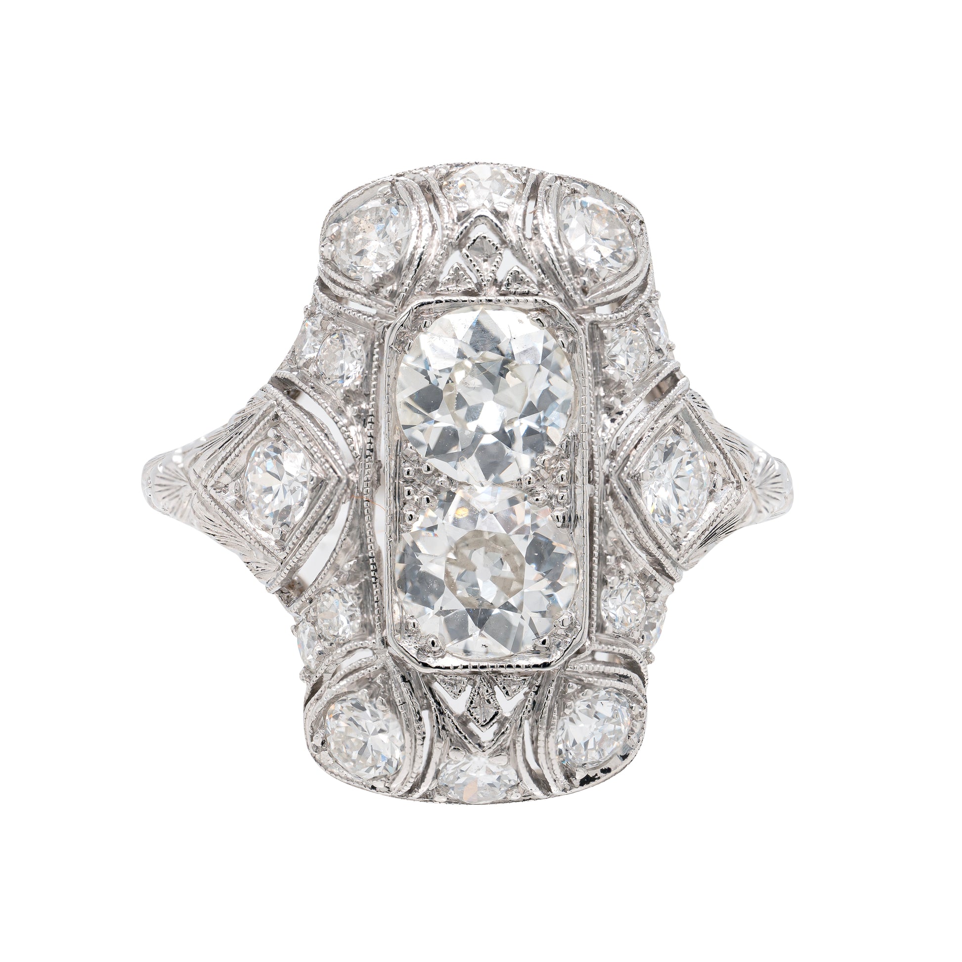 An antique Art Deco old mine cut diamond vertical platinum dress ring with smaller old European cut diamonds set in a rectangular panel with milgrain detailing.