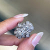 person holding art deco platinum dress ring 
