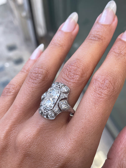person wearing an arty deco platinum dress ring 