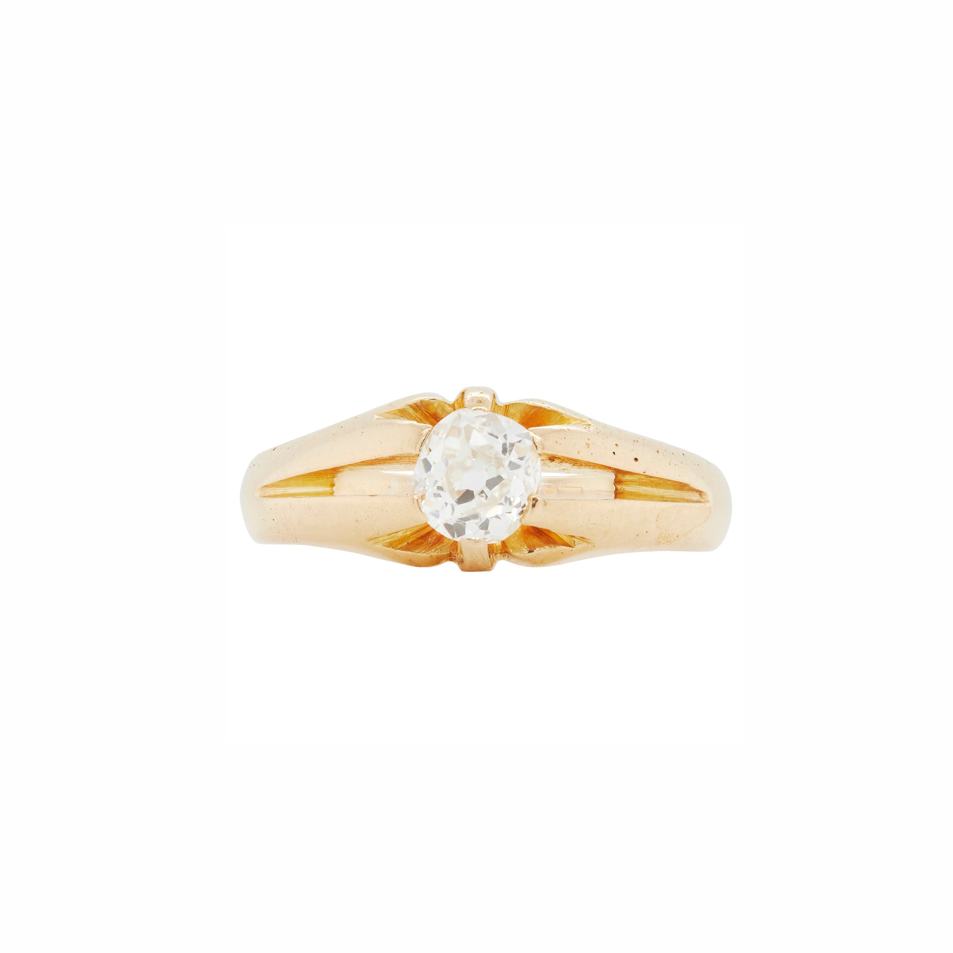 An 18K yellow gold solitaire ring with a central old mine cut diamond, raised on a six claw setting, against a white background.
