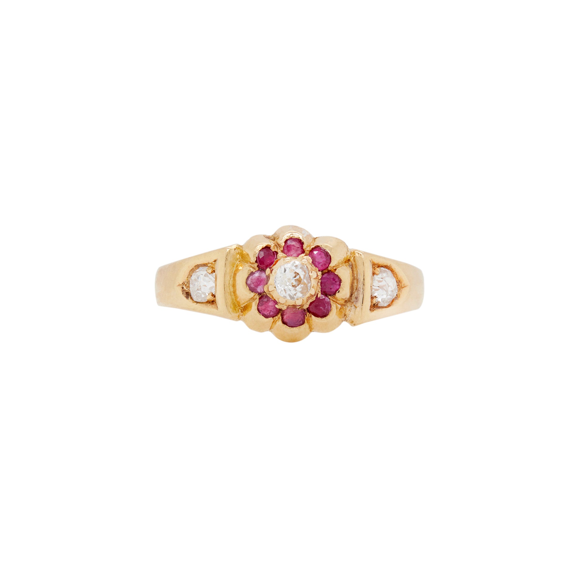 An 1884 Chester-made antique Victorian flower ring with a yellow gold band and old cut diamonds and red rubies