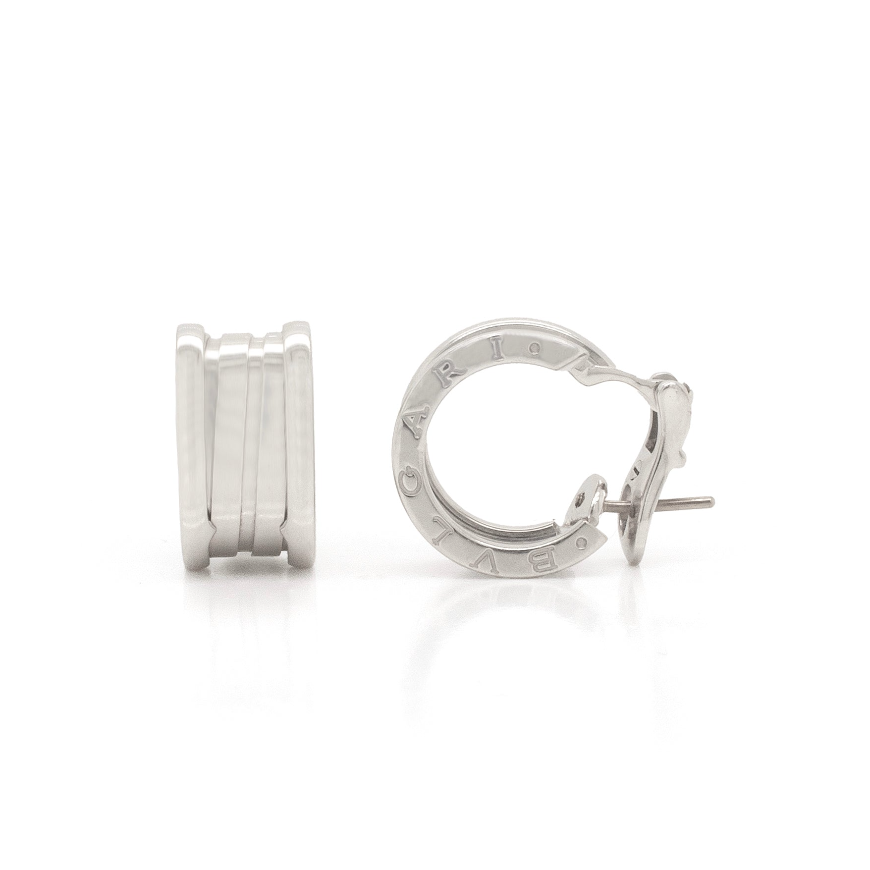 A pair of Bvlgari B.zero1 18 carat white gold small hoop earrings, with the brand's signature engraved on the outer edge.