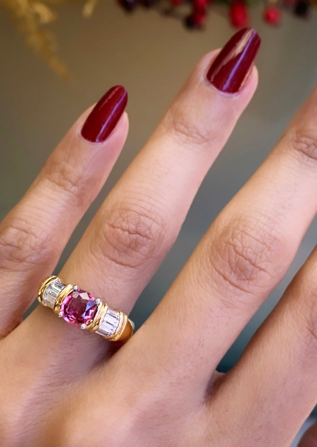 pink sapphire and diamond 18c yellow gold ring  on ladies finger