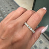 Hand wearing a Diamond full eternity stacking band ring in 18ct yellow gold, featuring round brilliant cut diamonds in claw setting,.