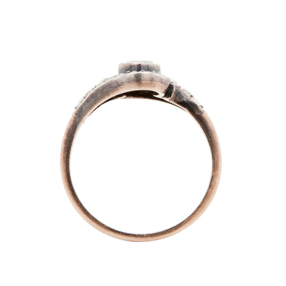 rose gold ring with diamonds on a white background