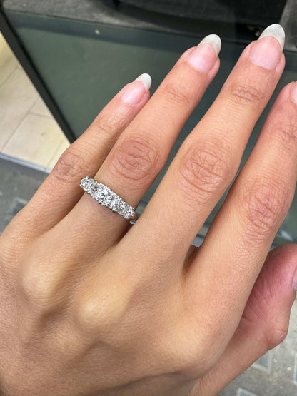 lady wearing Antique Five Stone Old Cut Diamond and Platinum Ring, circa 1900