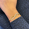 Diamond and 18 Carat Yellow Gold Infinity Bangle Bracelet