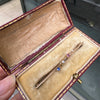 A delicate antique diamond, sapphire & ruby 9 carat rose gold bar brooch C.1910 in its original case