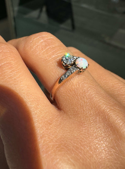 Ring with gemstones on a hand against a blurred background