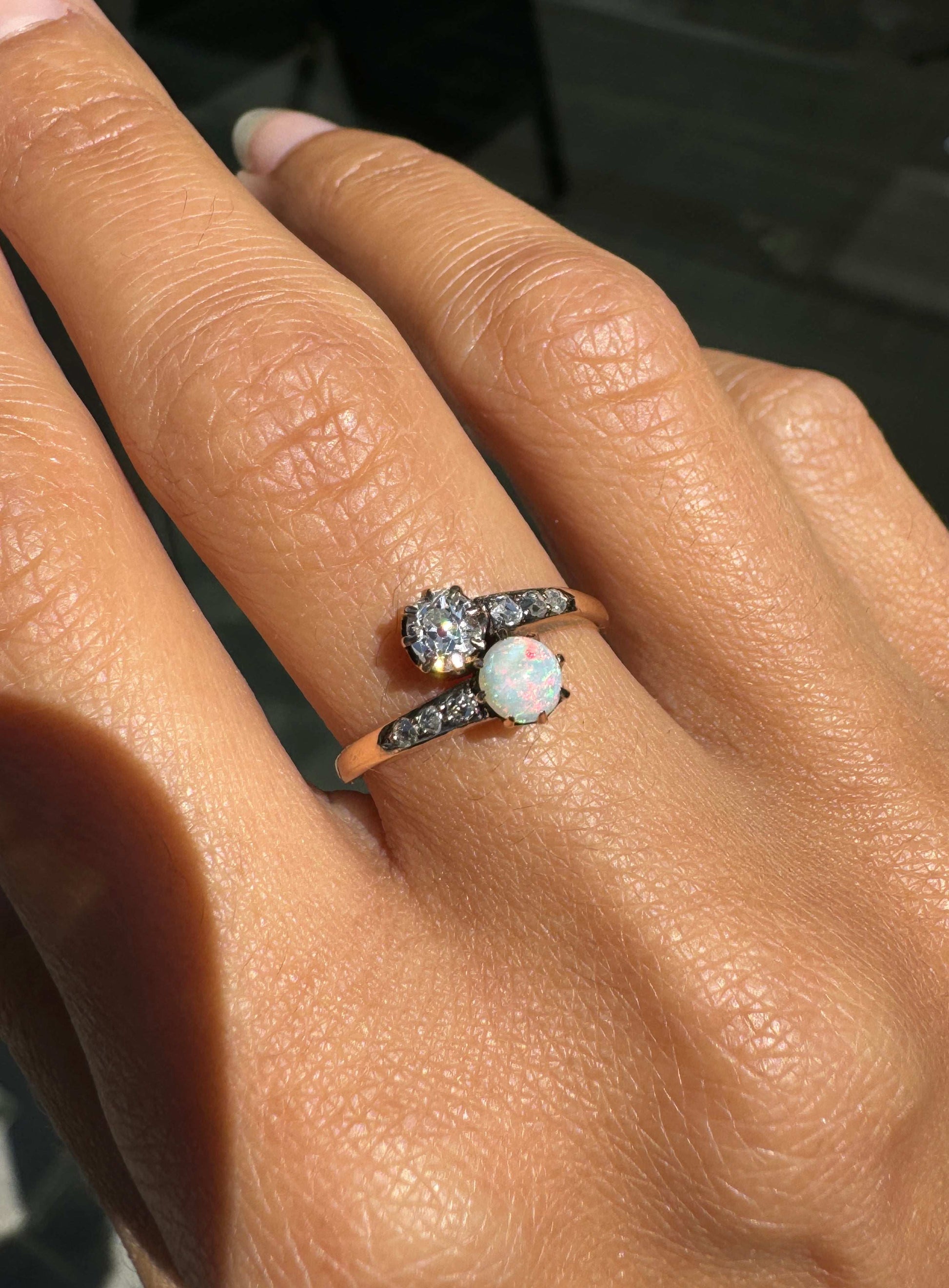 lady wearing Opal & Diamond 14K Rose Gold Crossover Toi Et Moi Engagement Ring, c.1900s
