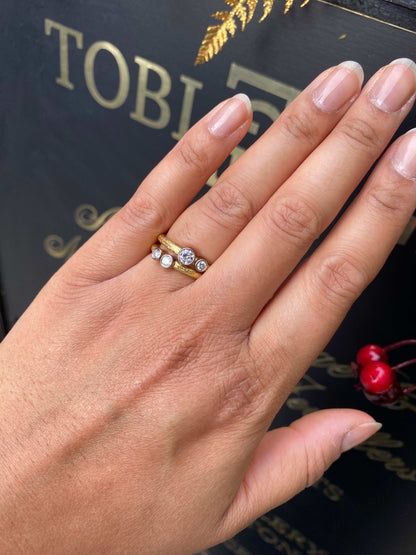 Pair of 18 Carat Yellow and White Gold Rub-Over Diamond Stacking Rings