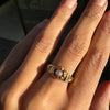 lady wearing antique ruby & old cut diamond flower and 18k gold ring