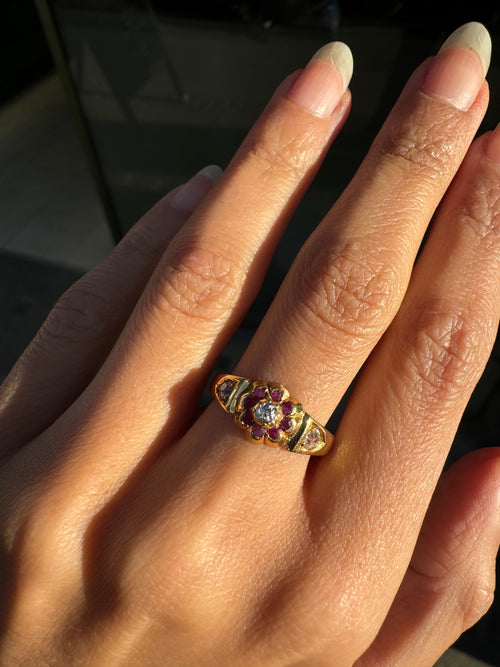 lady wearing antique ruby & old cut diamond flower and 18k gold ring
