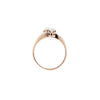 Gold ring with a small diamond on a white background
