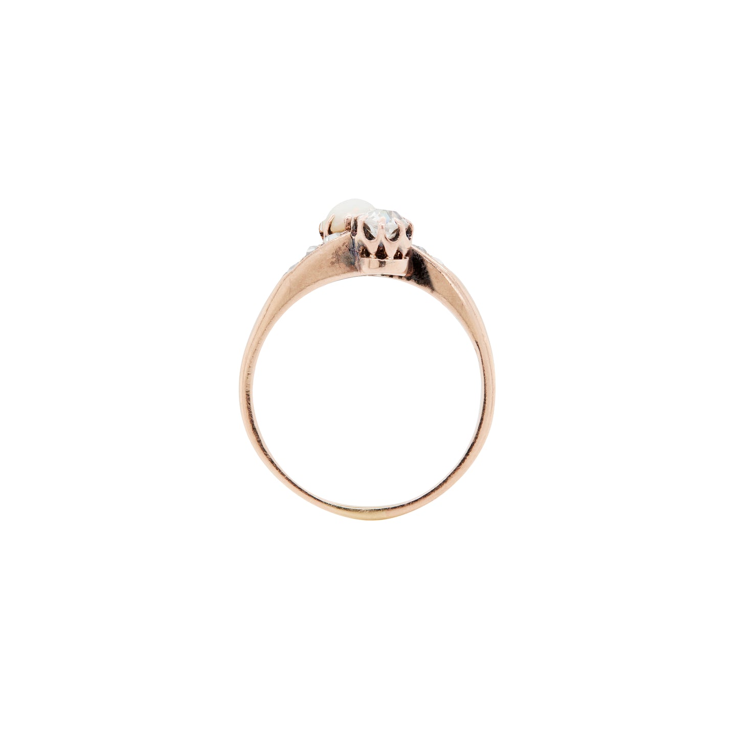 Gold ring with a small diamond on a white background