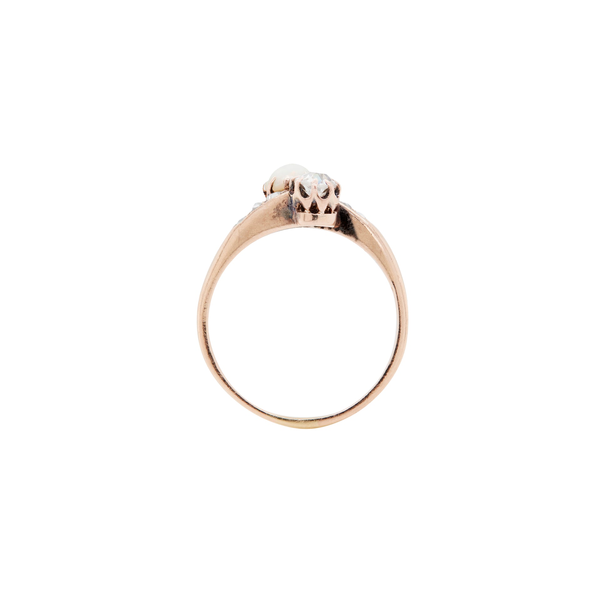 Gold ring with a small diamond on a white background