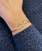 Diamond and 18 Carat Yellow Gold Infinity Bangle Bracelet