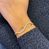 Diamond and 18 Carat Yellow Gold Infinity Bangle Bracelet