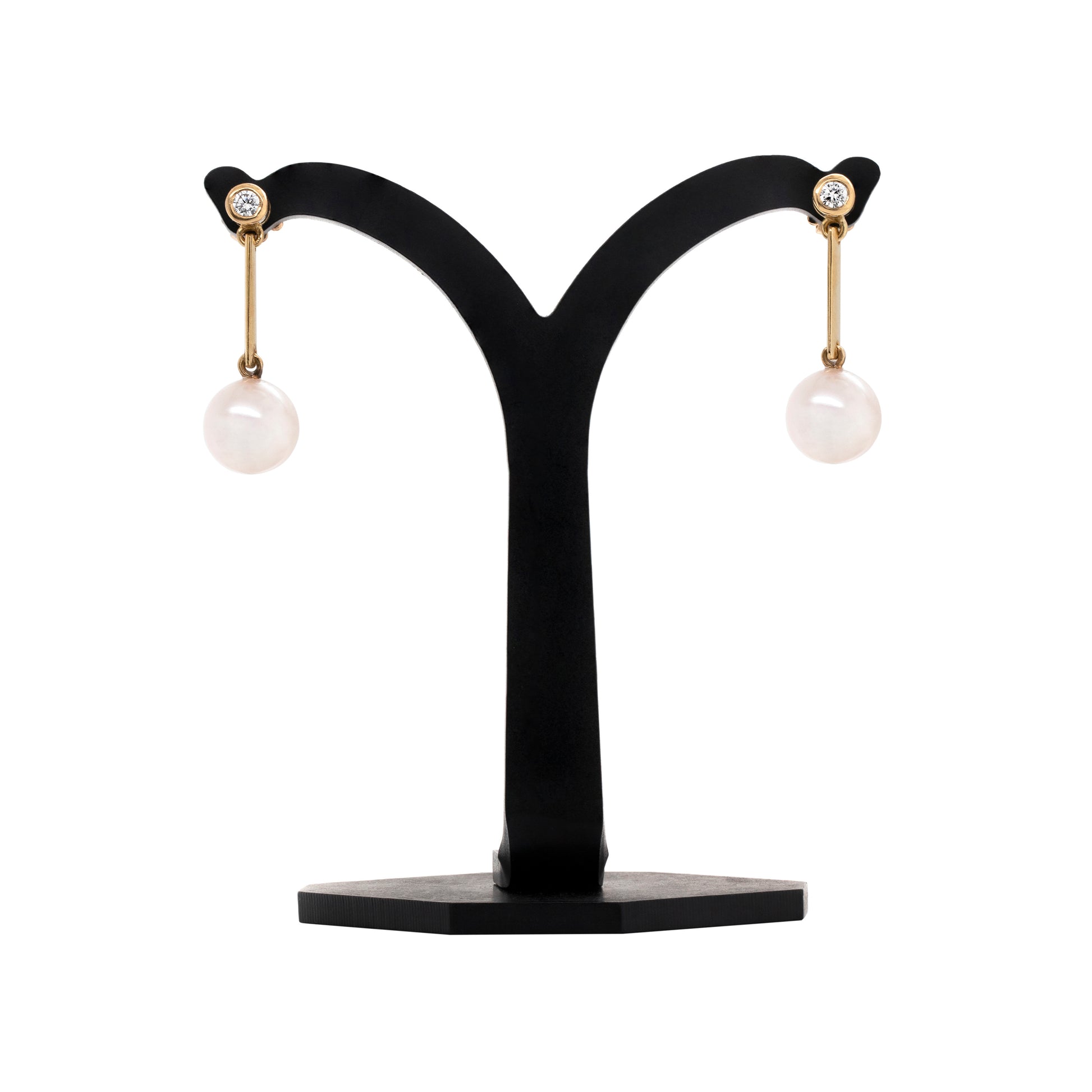 Freshwater Pearl and Diamond 18 Carat Yellow Gold Drop Earrings on a stand