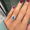 Oval Blue Sapphire and Diamond Halo 18K Gold Coronet Cluster Engagement Ring