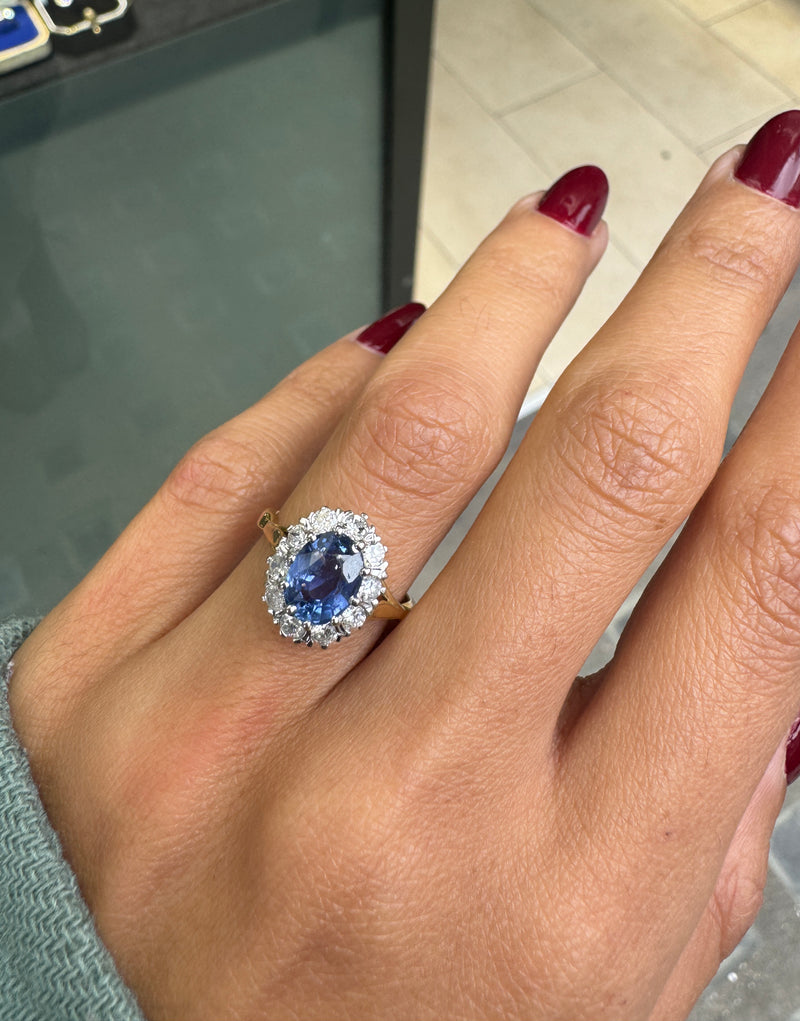 Oval Blue Sapphire and Diamond Halo 18K Gold Coronet Cluster Engagement Ring