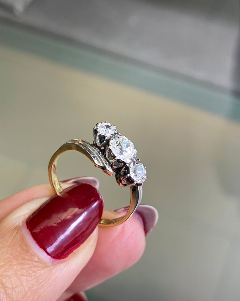 Old Cut Three-Stone Twist 18 Carat Gold and Platinum Ring, Circa 1920s