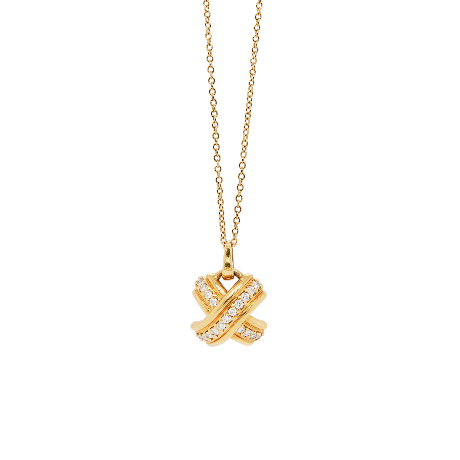 Tiffany & Co 18 carat yellow gold 'kiss' pendant necklace with a chain, featuring a domed X design with round brilliant cut diamonds.
