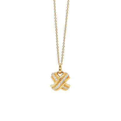Tiffany & Co 18 carat yellow gold 'kiss' pendant necklace with a chain, featuring a domed X design with round brilliant cut diamonds.