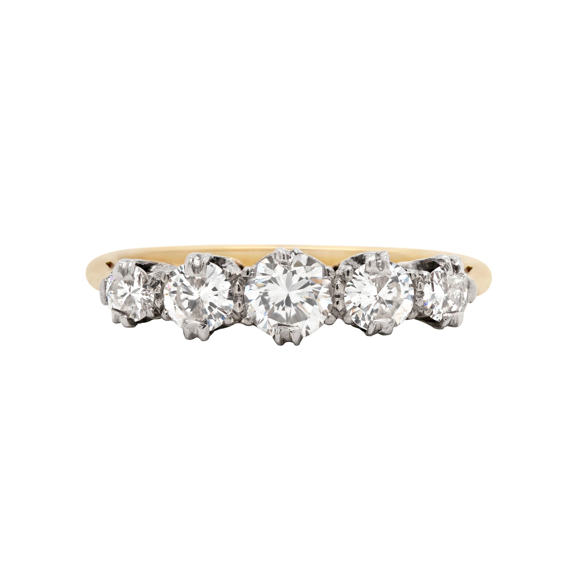 A vintage five-stone diamond ring with a yellow gold band, set with round brilliant cut diamonds in open back, platinum claw settings.