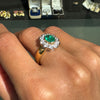 0.84ct Oval Emerald and Diamond Halo 18K Yellow and White Gold Cluster Ring