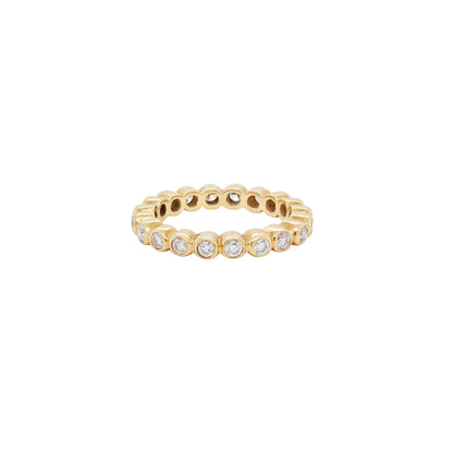 A yellow gold full eternity stacking ring with round brilliant cut diamonds set around its circumference.
