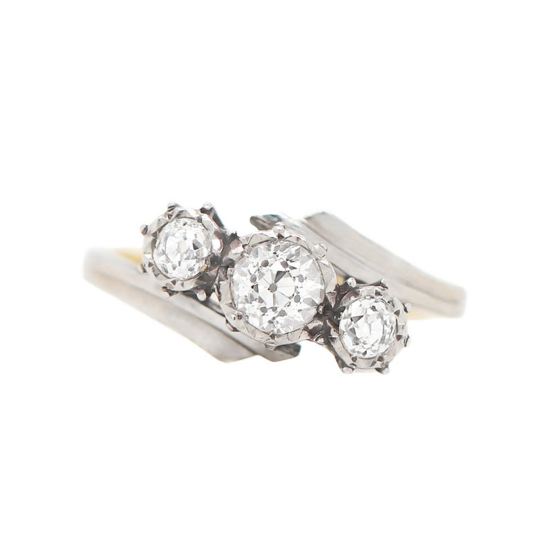 Old Cut Three-Stone Twist 18 Carat Gold and Platinum Ring, Circa 1920s