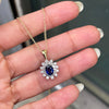 Oval Blue Sapphire and Diamond 18 Carat White and Yellow Gold Cluster Pendant