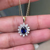 Oval Blue Sapphire and Diamond 18 Carat White and Yellow Gold Cluster Pendant