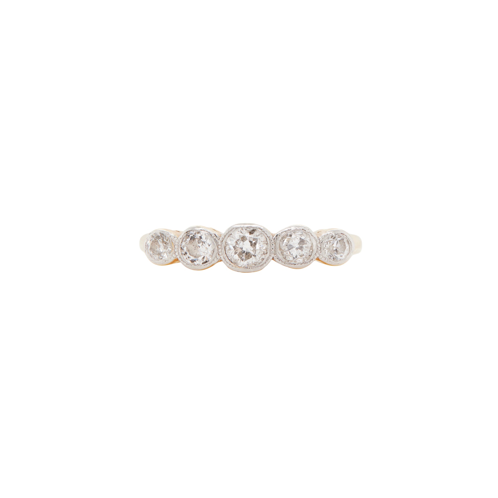 An 18 carat gold five-stone ring with old cut diamonds set in white gold bezels, featuring a yellow gold band.