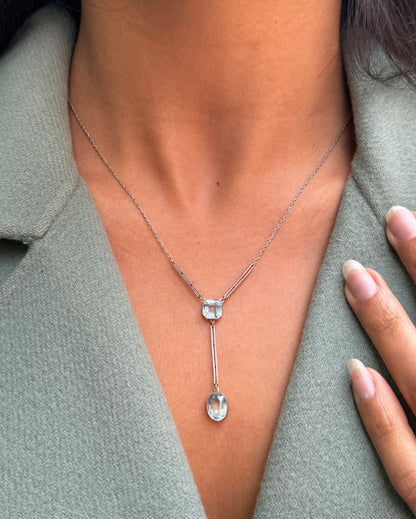 lady wearing a two stone 1920's Aquamarine and Palladium Drop Necklace