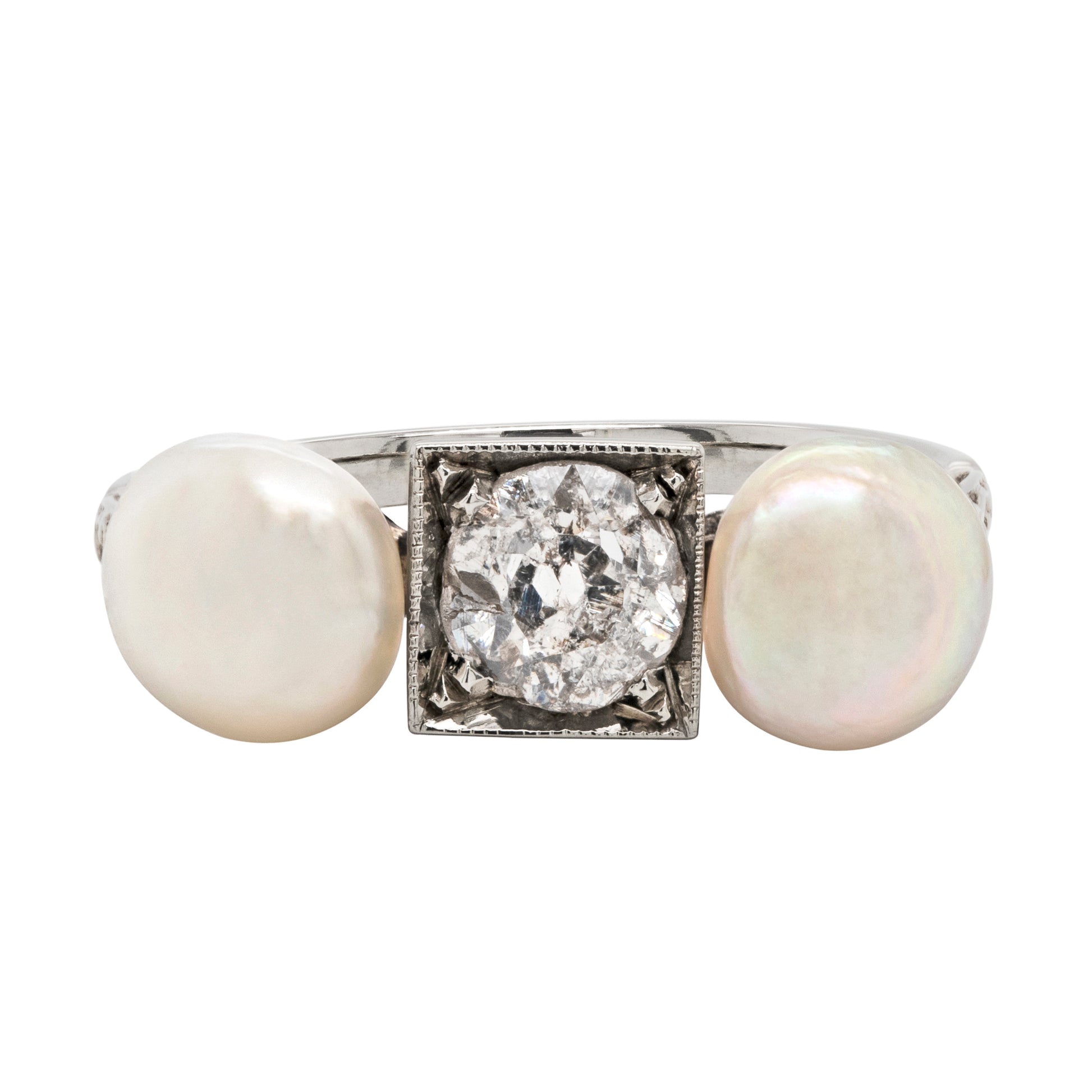 An antique old cut diamond and natural pearl 18 carat white gold ring, with the pearls on either side of a square frame and a central diamond.