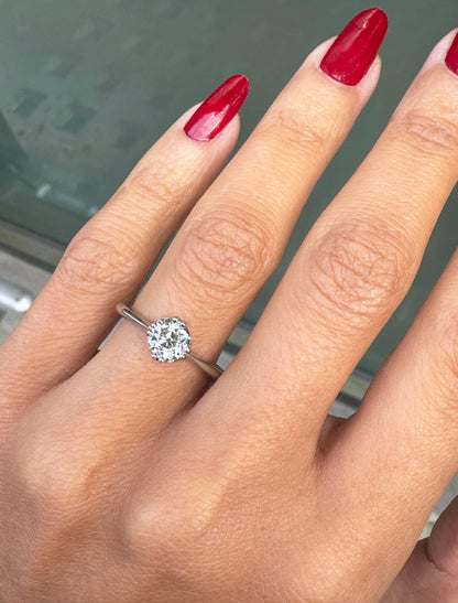 lady wearing diamond engagement ring 