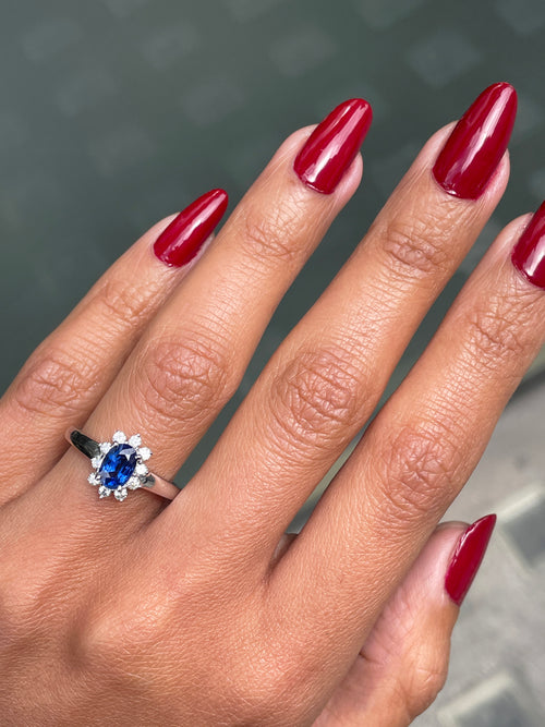 Oval Blue Sapphire and Diamond 18 Carat White Gold Cluster Engagement Ring