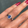 Oval Blue Sapphire and Diamond 18 Carat White Gold Cluster Engagement Ring