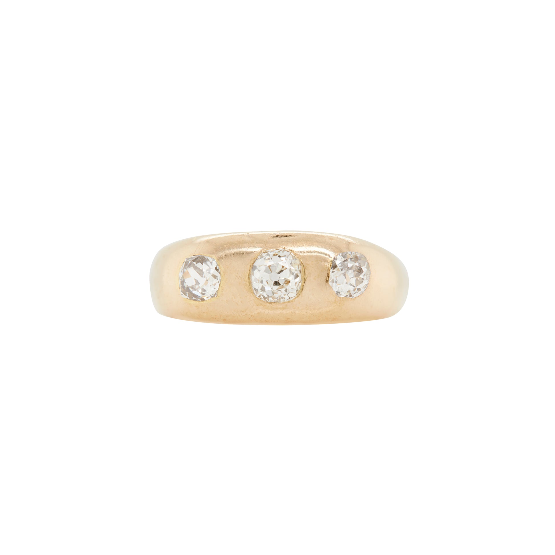 An 18K yellow gold gents three-stone ring with three old mine cut diamonds set in open back settings.