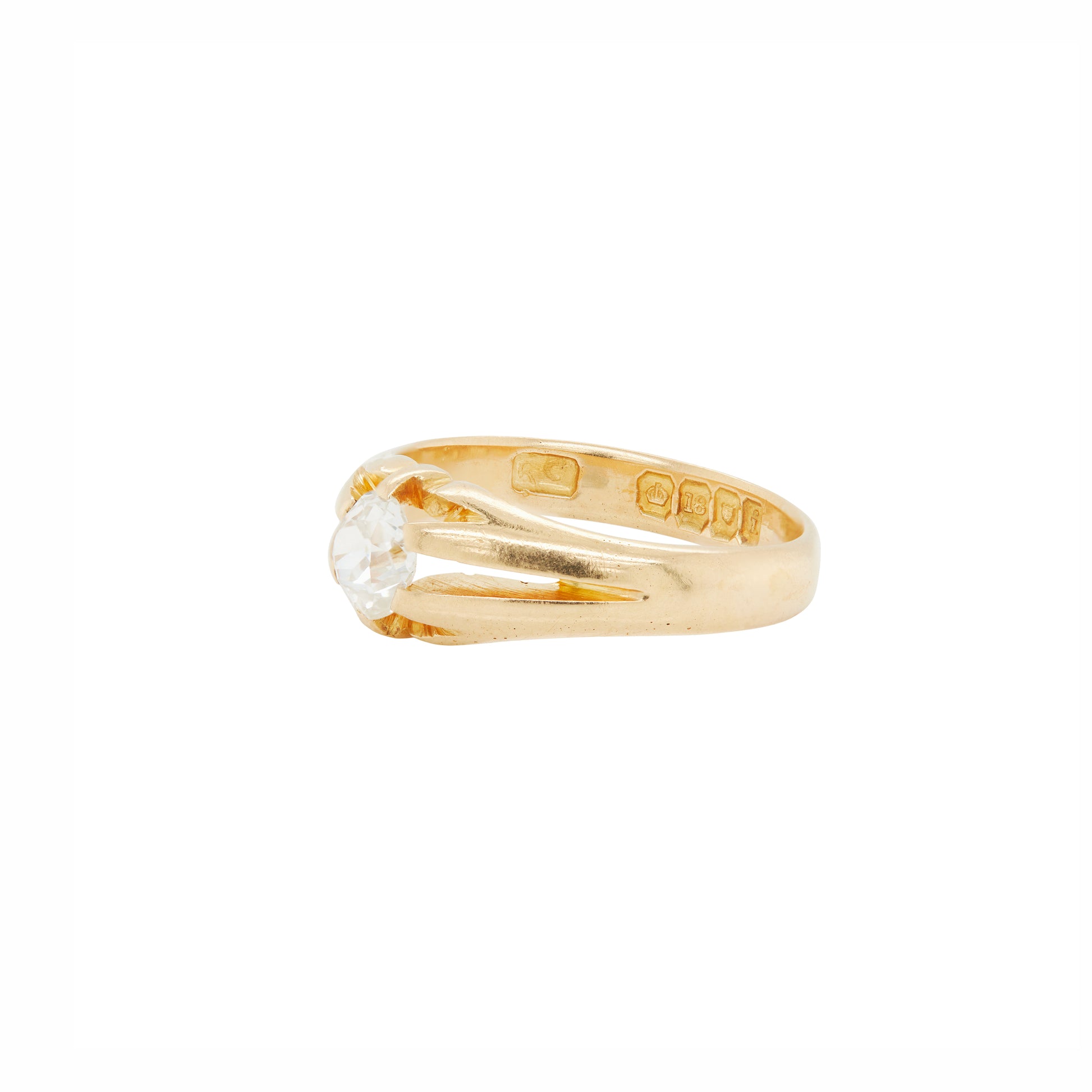 Gold ring with a diamond on a white background