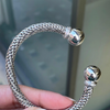person holding Diamond 18 Carat White Gold FOPE Woven Slip-on Cuff Bracelet