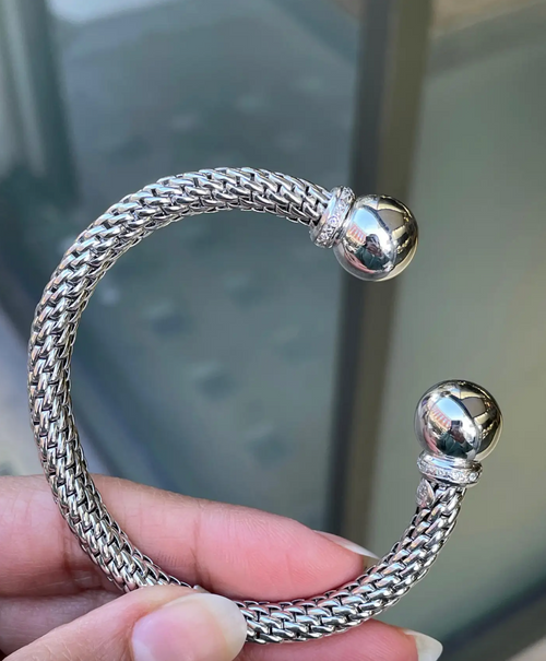person holding Diamond 18 Carat White Gold FOPE Woven Slip-on Cuff Bracelet