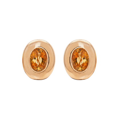 A pair of 18 carat yellow gold large oval stud earrings with a central citrine stone.
