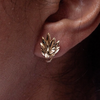 lady wearing a leaf motif 18 carat gold earring