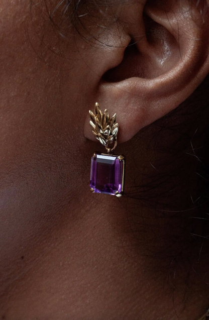 lady wearing a Vintage Amethyst 18 Carat Yellow Gold drop earing